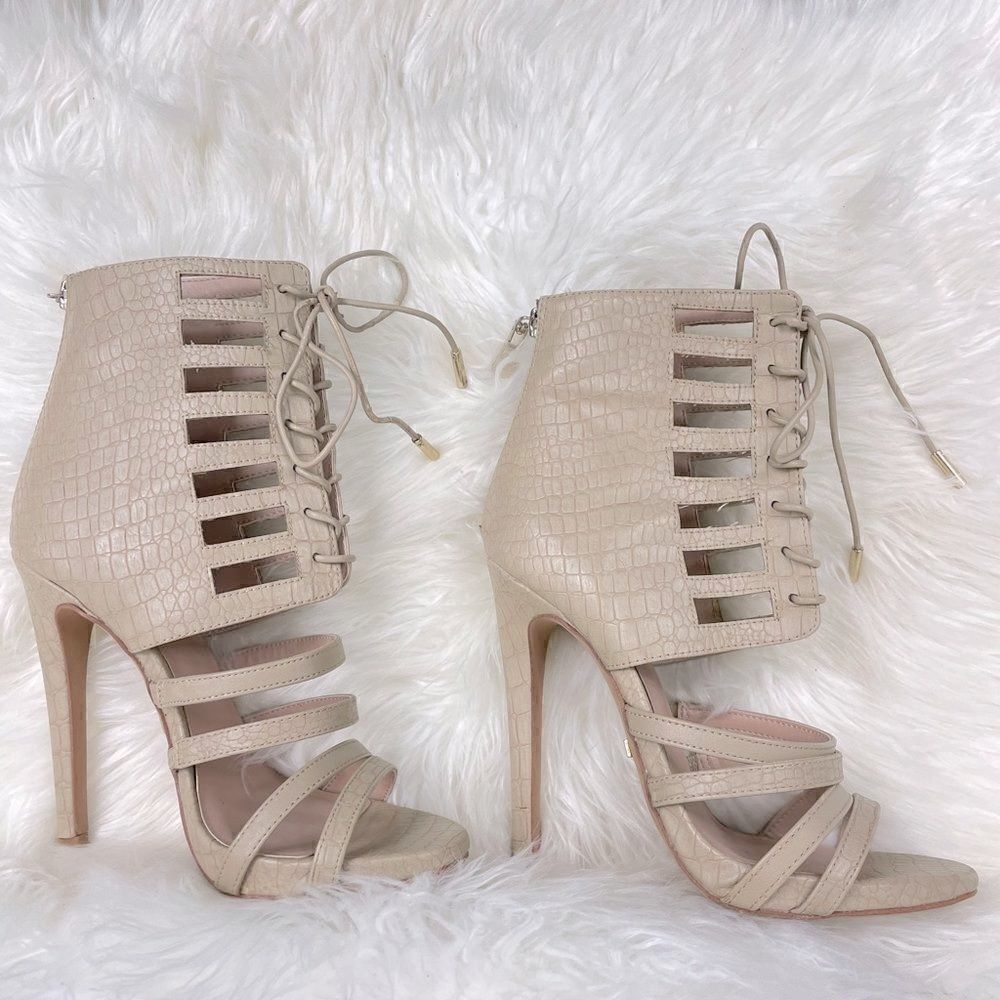 bebe | strappy open toe cream sandal stiletto 7.0 4” heel back zipper closure.